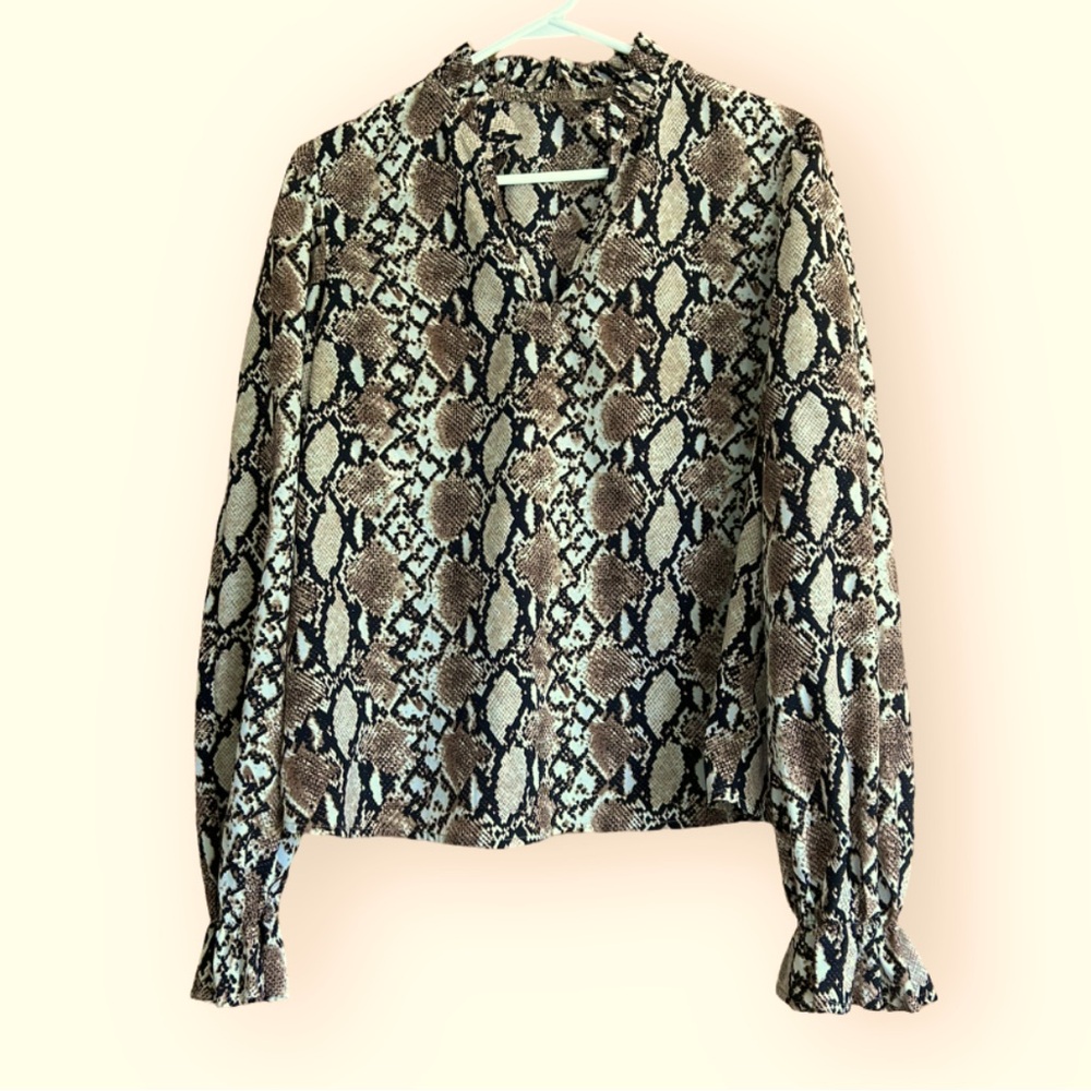 Cheetah/leopard print blouse. Business casual.